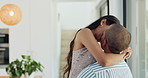 Couple, hug and kissing for love at home, happy and support in marriage and embrace for romance. People, spin and bonding together for relationship, lovers and commitment or loyalty in apartment