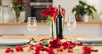 Empty table, wine glass and roses for love, romance and valentines day background at home. Decoration, luxury glassware and champagne or alcoholic drinks on anniversary, date or honeymoon for dinner