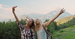 Two women taking selfies. Best friends taking selfies on holiday.