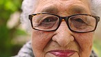 Face, expression and wrinkles of senior woman with glasses looking sad, old and frail during retirement in Indonesia. Portrait of elderly lady, grey hair and looking at camera with bad eyesight