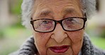 Portrait of a sad elderly woman with an eye problem in an outdoor garden at the old age home during summer. Closeup of a unhappy senior lady in retirement in nature for mental health and wellness.