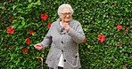 Dancing, music and elderly woman in a garden listening to radio for wellness or healthy body. Senior pension lady dance with earphones and smartphone technology for healthcare, mobility and vitality