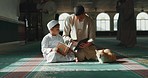 Quran, child and man teaching in a mosque for praying, peace and spiritual care in holy religion for Allah. Reading book, learning or Muslim person with tablet, kid or education to help worship God