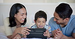 Tablet, laughing and kid with parents on bed watching video, movie or show on the internet. Happy, bonding and boy child with mother and father streaming film on digital technology in bedroom at home