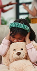 Parents, fight and girl on sofa with teddy bear for comfort from shouting, noise or dispute at home. Stress, divorce or kid in living room with screaming people, abuse or custody argument in house