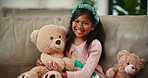 Smile, happy and indian girl with teddy bear on sofa in living room of home, alone for comfort or joy. Portrait, kids and adorable young child in apartment hugging stuffed toy animal for consoling