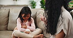 Shouting, kid and parent in home for conflict, angry or bad behavior of family in living room. Scolding, girl and child with mother for discipline, frustrated and screaming at daughter for punishment