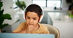 Laptop, thinking and headphones for home school with boy student in online class for child development. Computer, education or virtual elearning with young kid in apartment for internet assessment