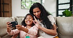 Family, selfie and mother on sofa with daughter in living room of home for social media profile picture. Love, smile or happy with woman and girl child in apartment to relax for photograph or bonding