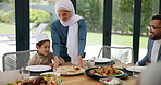 Muslim, family and children with food or dinner at dining table for eid, islamic celebration and hosting. Ramadan, culture and people at religious gathering with roti, chicken or happiness with feast