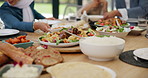 Closeup ,healthy food or hands of family in home with lunch, drinks or celebration in social gathering event. Group of people, eating or plate on table with dinner, meal or brunch with salad or bowl