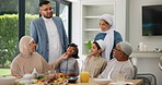 Big family, smile and dinner for eid celebration, Muslim people at table together in home. Grandparents, parents and children at Iftar in dining room for food, Islamic culture and Ramadan in Morocco.