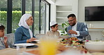 Muslim, family and children with food or dinner at dining table for eid, islamic celebration and hosting. Ramadan, culture and people eating at religious gathering with lunch, discussion or happiness