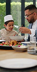 Share, food or father with child in home with salad, plate or celebration of breaking fast Eid or Ramadan. Group of Muslim people, family eating or dad with kid for dinner, meal or brunch with feast