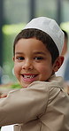 Child, face or Islamic family at table in home with lunch, supper or celebration of Ramadan fast or Eid. Portrait, happy boy eating or Muslim kid with dinner, meal or food with feast, brunch or smile