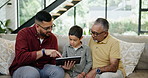 Dad, son and grandparent on sofa with tablet in living room of home together for visit. Family, technology for gaming or education with senior man, father and grandson in apartment for learning