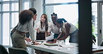 Meeting, documents and team of business people in office boardroom working on project together. Diversity, paperwork and professional creative designers brainstorming in collaboration at workplace.
