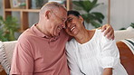 Hug, love and senior couple on a sofa laughing, happy and bonding at home together. Retirement, support and elderly people embrace in a living room with funny, joke or silly conversation in a house