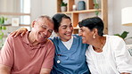 Happy, senior and couple hug with nurse on sofa for healthcare, support or trust together at home. Face of elderly man, woman and caregiver smile for embrace, care or nursing in living room at house