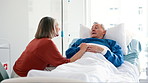 Senior woman, comfort and husband in hospital bed with cancer, illness or sick with chat for support. Elderly patient, man and couple with talk, empathy and love in retirement with memory in clinic