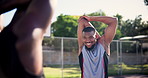 Sports, basketball and men stretching arms for training, game or match on outdoor court. Fitness, team and group of young African male athletes with warm up workout or exercise on outside pitch.