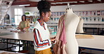 Tailor, mannequin and black woman sewing clothes, textile or fabric in startup business. Fashion designer, atelier and person with garment on dummy, creative and seamstress working in studio workshop