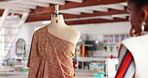 Black woman, fashion designer and mannequin with garment for stylish outfit, size or apparel at workshop. African female person, tailor or seamstress with model or template for clothing production