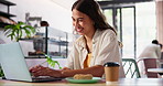 Laptop, breakfast and woman in coffee shop working on creative freelance project on internet. Research, technology and young female designer with food and typing on computer in cafe or restaurant.