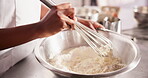 Hands, eggs or whisk flour mixture on table, chef or process of dough wheat on kitchen counter. Baker, working and wet to dry ingredients for french bread, hospitality and culinary cooking in hotel