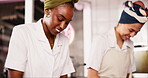 Bakery, women and prepare dough in kitchen for pastry in a small business with a smile. Kitchen, restaurant and diverse team cooking or baking bread for food in a cafe with training for a chef