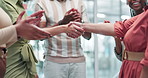Applause, shaking hands and closeup of business people in office for deal, partnership or agreement. Clapping, teamwork and group of professional creative designers with handshake in workplace.