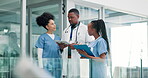 Doctor, nurses and reading on tablet for healthcare research, hospital planning and teamwork with clinic services. Medical staff with checklist, clipboard or charts for solution on digital technology