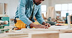 Construction, wood and planning with black man in workshop for manufacturing, measure and building. Hardware, remodeling and maintenance with carpenter in small business for timber and production
