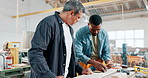 Man, tablet and carpenter in teamwork for construction, supply chain or production and woodwork at workshop. Male person, builder or craftsman working together with technology on table at warehouse