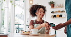 Customer service, cafe and phone payment for waffles, food and breakfast with POS machine and waiter hands. Young African woman with mobile tap or digital transaction at small business or coffee shop