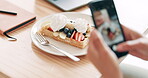 Hands, cellphone and food photography in restaurant for dessert, update and post to social media for connection. Person, mobile app and picture of waffle with cream, fruits and nutrition for eating