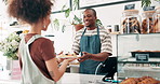 Cashier, cafe breakfast and customer service at counter with thank you, POS tablet for food order and hospitality. Black man or waiter typing on fintech of price or profit of waffles at a coffee shop