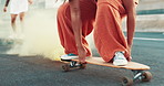 Skateboard, street and flare smoke with person, feet and freedom in metro with fashion, warning or attention. Skater, shoes or sneakers in streetwear clothes with torch, signal and culture on bridge