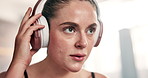 Workout, headphones and woman in gym breathing on break from fitness to relax with streaming service. Music, rest and tired girl at exercise club with health, wellness and listening to earphones.