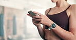 Phone, hands and woman at gym for fitness, workout or training progress, social media and chat of health tips. Person typing on mobile for communication, network and search or sign up for exercise