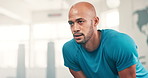 Exercise, tired and breathing with man in gym to rest from workout for health or cardio. Face, sweating and intensity with exhausted young athlete training for fitness, performance or improvement