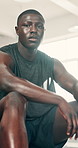 Black man, fitness and break in sweat for workout, exercise or intense training at indoor gym. Portrait of African male person in rest, breathing or recovery after cardio activity, health or wellness