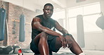 Fitness, gym and face of tired black man breathing after training, workout or intense exercise. Health, portrait and African athlete sweating at a sports center for wellness, resilience or challenge