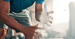 Man, hands and clapping chalk in fitness, preparation or getting ready for workout, weightlifting or exercise at gym. Closeup of person, athlete or muscular bodybuilder hitting powder at health club