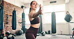 Woman, workout and pilates in gym for fitness, exercise and body health, wellness and flexibility or movement. Young and serious person in warm up, stretching and arms or muscle training with balance