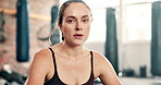 Tired, breathing or face of fitness woman at a gym for training, exercise or intense morning cardio. Sports, portrait or athlete sweating on recovery break from body workout, challenge or performance