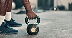 Fitness, hands or strong man training with kettlebell, powder or dust power in workout for grip on gym floor. Closeup, lifting weights or healthy sports athlete in exercise for muscle development