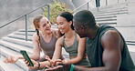 Fitness, phone and friends on steps for break from training or workout together or reading social media. Exercise, sports and performance tracker with athlete group laughing at app or meme on mobile