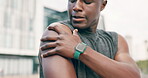 African man, fitness and shoulder pain with injury, city and workout for health, wellness and training. Runner, cape town and hand with muscle, exercise and sport for motivation, cardio and tension 