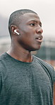 Fitness, city and tired black man thinking of running journey, workout goals and listening to music or podcast. Young athlete, runner or sports person breathing, exercise break and ready for training